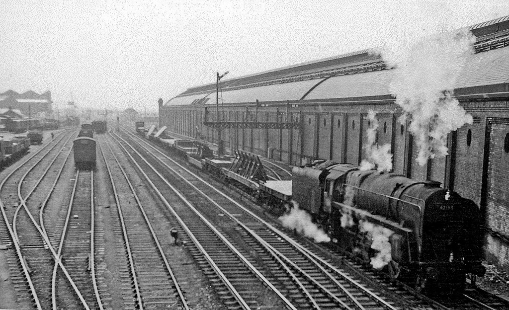 A steam-hauled freight train passing through Darlington Bank Top station in April 1961